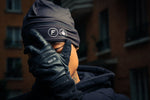 Homme cachant son visage avec Finesse Leather Gloves, portant aussi le 2-Shots Beanie.