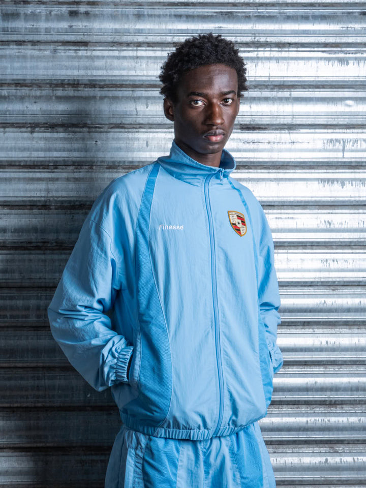 Model wearing the 911 Zip Jacket Blue - Finesse lookbook