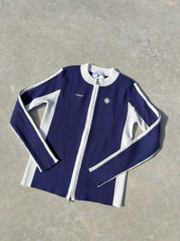 Finesse Woman To Zip Jacket bleue et blanche présentée à plat.