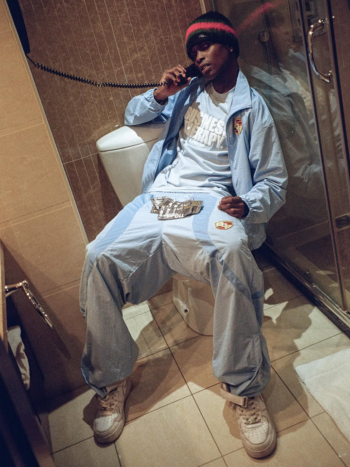 Model wearing the Business Therapy Tee Baby Blue with the 911 Zip Jacket Blue - Finesse lookbook