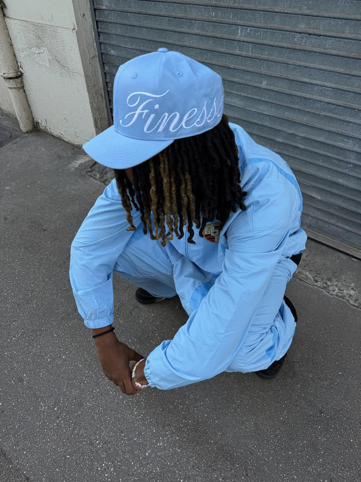Model wearing the Sign Cap Baby Blue - Finesse lookbook